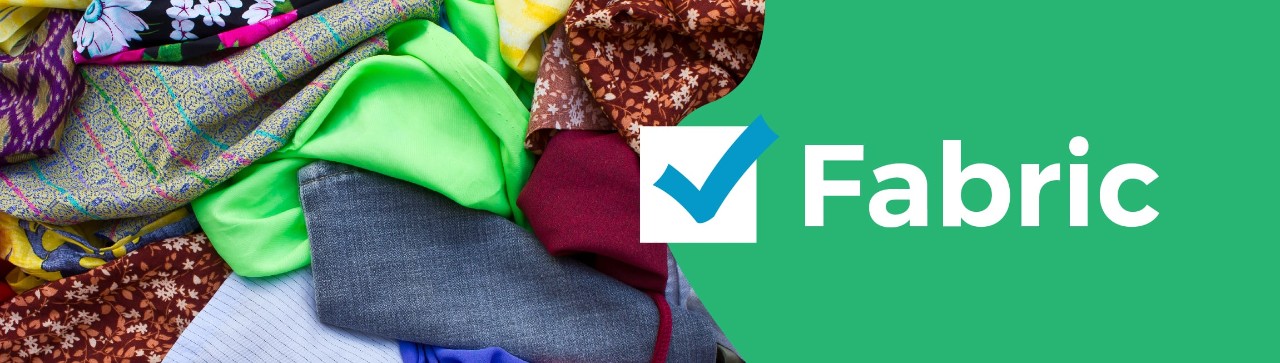 Pile of clothes on left hand side, blue-checked box in center, the word "fabric" on the right