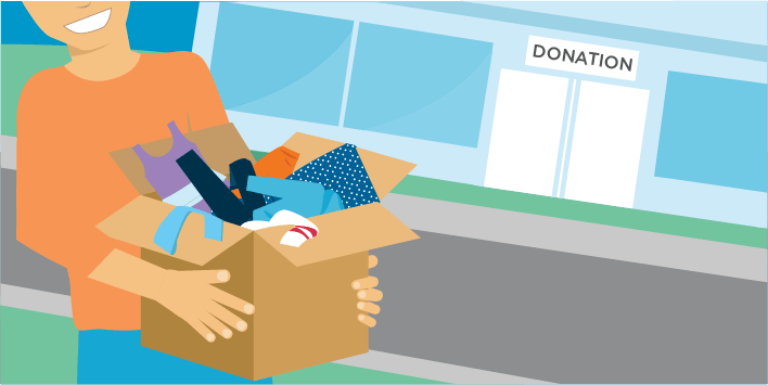 Person with box full of old clothing walking to a donation center. 