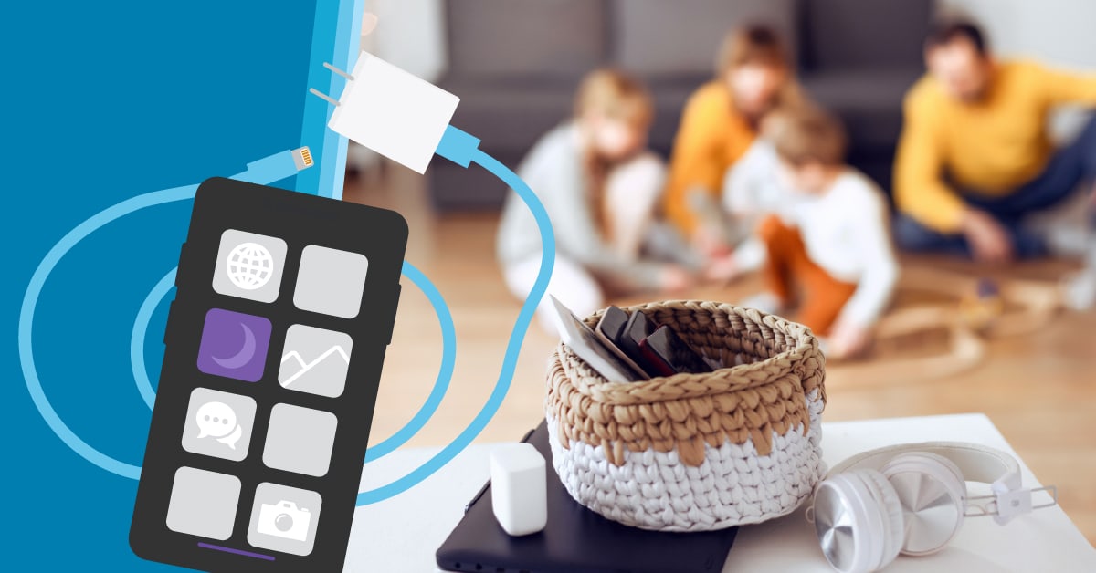 Digital Detox. Phones in basket while family plays together.